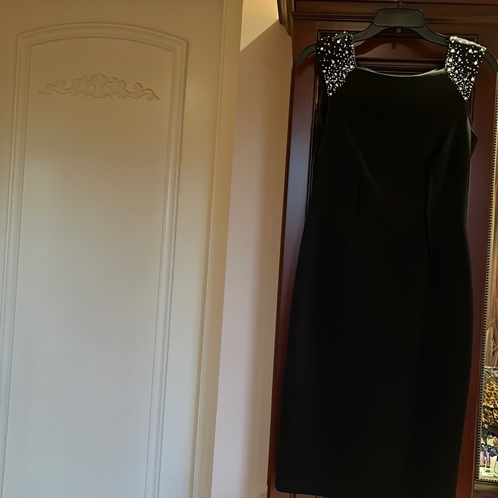 Black cocktail dress with pearls at shoulders